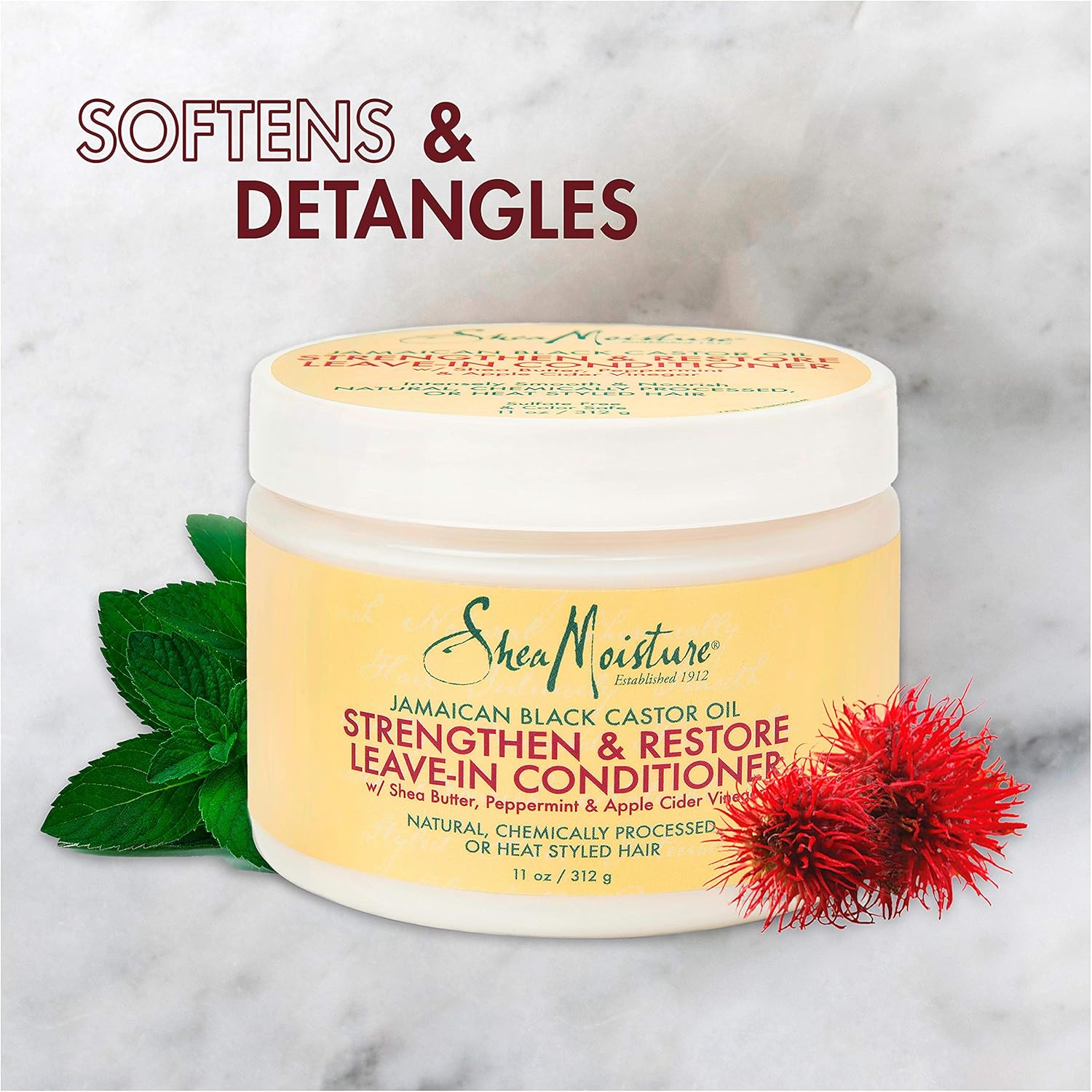 Shea Moisture Jamaican Black Castor Oil Strengthen & Restore Leave-In Conditioner, 11.5 oz jar. Close-up of Shea Moisture leave-in conditioner with shea butter, peppermint, and apple cider vinegar.